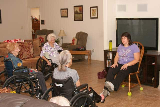 A caregiver with a resident at Aspen Care Home